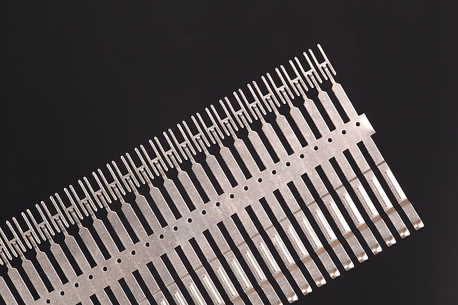 Punched strips - Intermediate or end product of a CNC punching process of several punching tools connected in series